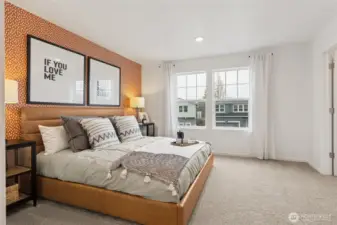 “Large windows provide natural light in the primary retreat.”