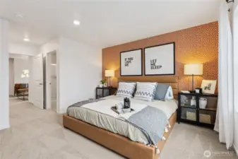 “Spacious primary suite designed for rest and relaxation.”
