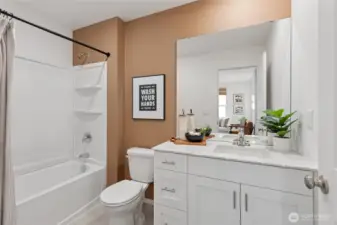 “Well-appointed hall bath with contemporary finishes.”