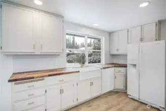 Newly painted cabinets dishwasher is virtually staged