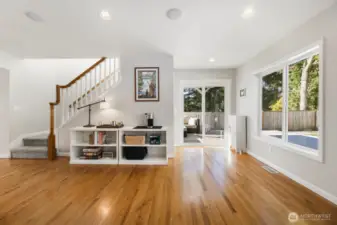 Sliders off the kitchen that lead to a covered deck with heater and more decking for entertaining