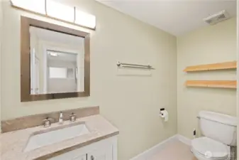 Good sized bath with built in cabinets.