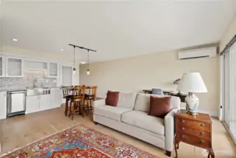 Warm and welcoming open living.  Door in center is stack washer and dryer.