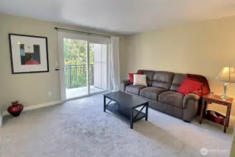 Living room with slider to deck.