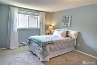 Primary bedroom with 3 door closet.