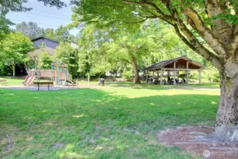 Play structure & covered picnic space. Roof of the complex in the photo