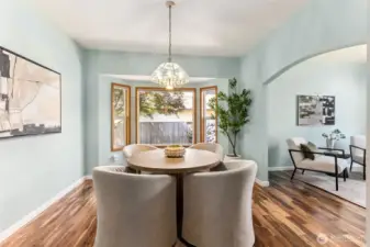 Dedicated dining room with new hardwood flooring with arched entry, vaulted ceilings and bay window, so much natural light. Newly painted. Owners have also opted to use this room for multiple purposes such as formal living, study/office, den, playroom, library, media room, game room, etc.