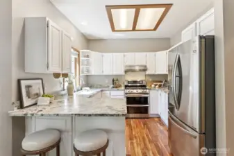 Beautiful, renovated and updated kitchen with new granite counters, cabinets and stainless steel appliances