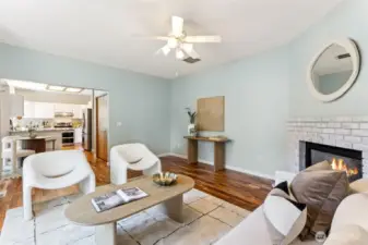 Living room with gas fireplace; large windows