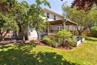 Large lot with fully-fenced backyard with covered patio and garden spaces