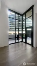 Corner of glass wall overlooking the large outdoor space.