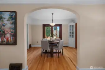 Arched doorway leads to dining room.