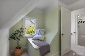 Adorable window seat in second bedroom.