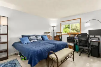 Primary bedroom with room for storage and desk, if desired.