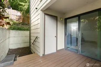 Patio features storage closet, plus access to side yard in this corner lot.