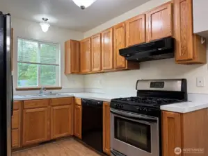 Open kitchen with updated cabinets