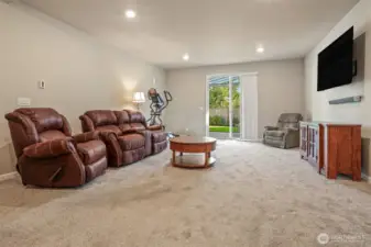 Daylight lower level family room with sliding door to covered heated patio and private fenced back yard.