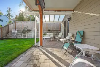 Covered heated patio and private fenced back yard that boarders a community greenbelt and park.