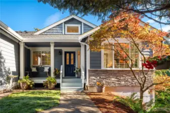 A covered entry and porch greet your guests and keeps them out of the rain. Stone accents add a nice architectural detail to this lovely home.