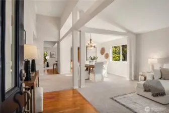 The formal entry opens up to soaring vaulted ceilings and an oak entryway.