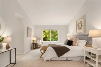 Double french doors open up to this massive primary suite with vaulted ceilings, new paint, new carpet and a spa-worthy en suite.