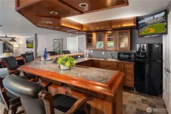 Recessed lights above the bar and underneath the counter as well as recessed lights in the soffit.