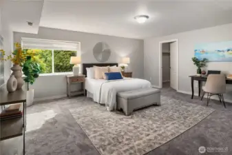 The fourth bedroom located downstairs is as large as the primary and features a big walk-in closet as well as a second closet to the left.