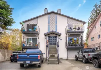 2 car tandem parking in the open space to the right of the stairs.