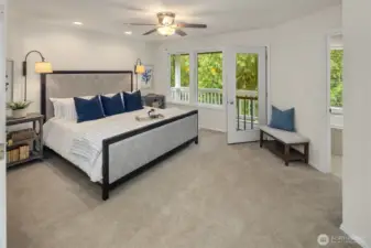 The Upstairs Primary Bedroom Suite with Juliette Balcony that overlooks the backyard and lake.