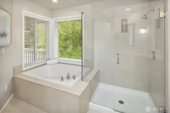 Corner bath tub & shower in the Primary Bathroom