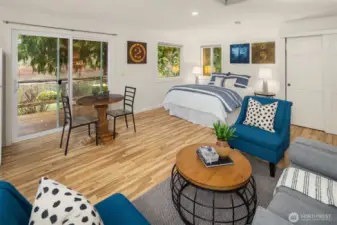 The cottage slider door leads out the deck area that overlooks the lake! This cottage has been freshly painted.