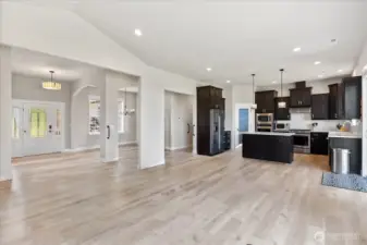 Beautiful open concept of the main living  area. Home features 10' ceilings. (Furniture  has been digitally removed.)