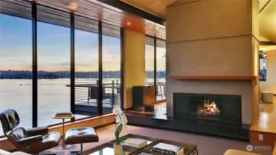 Enter at the main level to walls of glass overlooking westerly views of Lake Washington