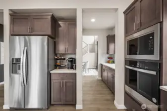 Kitchen looking through Butler's Pantry towards Dining Room. Photos are for representational purposes only.  Colors and options may vary.