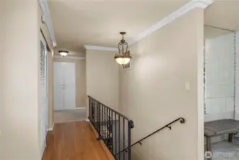 Main floor hallway and stairs to lower level
