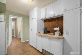 Lower level hallway with fridge, endless storage refreshment area
