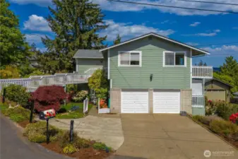 Gate to the left of the garage leads to private entrance to lower level office/studio or potential MIL/Airbnb.