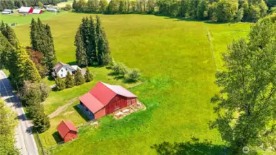 The home and outbuildings are located on a 20+ acre piece.  With the AG10 zoning it may be possible to create another building lot.  Buyer to verify.