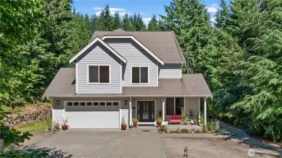 Welcoming porch and plenty of parking