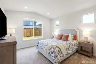 A private retreat, this primary bedroom is located off of the great room area and is separated from the other two bedrooms.