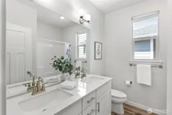 Full bathroom located near the front of the home and near two spacious bedrooms.