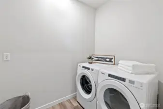 The large utility room is conveniently located between all the bedrooms, with virtually brand-new washer & dryer that still have stickers on them! The room is also stubbed for a future utility sink.