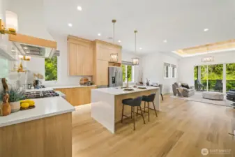 Step into the heart of the home—where a commercial-grade range, pot filler, and quartz counters invite you to cook, create, and gather in style. This kitchen isn't just functional—it's unforgettable. The waterfall island finish and slab quartz back splash really set the stage for a luxe experience.