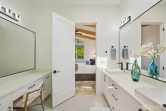 Escape to your vaulted primary suite—spa-inspired bath with heated floors offers impeccable comfort and a serene seaside retreat every day. Double sinks and a full vanity.