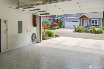Smart luxury extends to the epoxy-finished garage floor: easy maintenance and sleek style make every corner of this home feel polished and purposeful.
