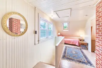 Upstairs is one big room divided into separate sleeping areas.
