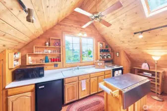 Compact kitchen fully stocked for a comfortable stay.