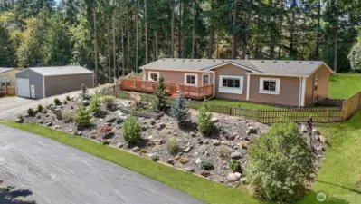 Explore the possibilities inside and out at this spacious home on a large lot, with a shop! Lawn has been edited for photography purposes.