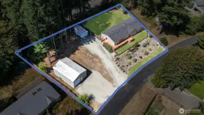 Enjoy plenty of room for hosting events or just enjoying the scenery. Lawn has been edited for photography pursposes.  Blue boundary lines are approximate. Buyer to verify to own satisfaction.
