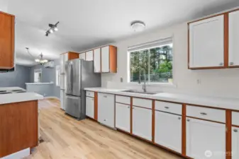Storage is no issue in this kitchen! The cabinets also feature space above for additional storage or decor.